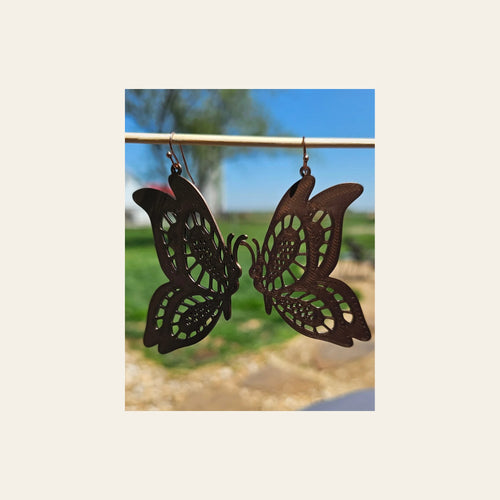 3D Print Butterfly Boho Earrings on a warm cream background