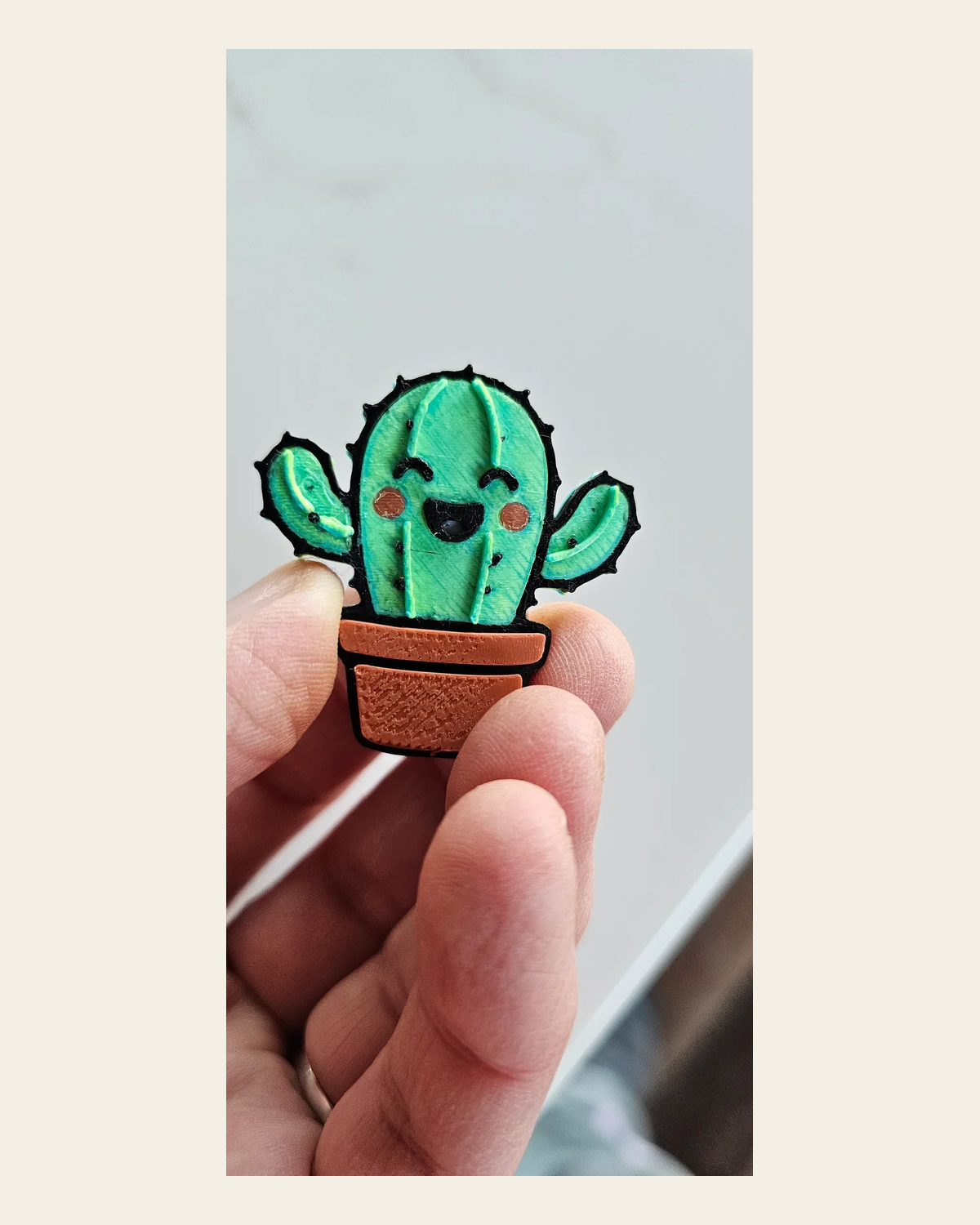 3d Happy Cactus Hat Pin on a warm cream background