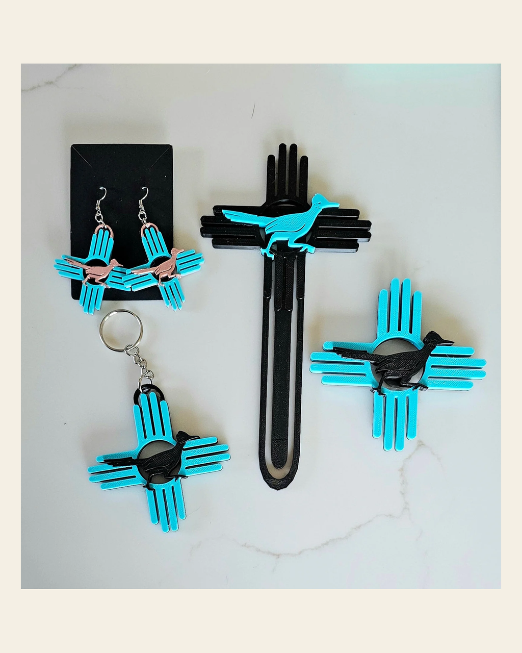 3D New Mexico Zia Magnet or Bookmark or Keychain or Earrings on a warm cream background