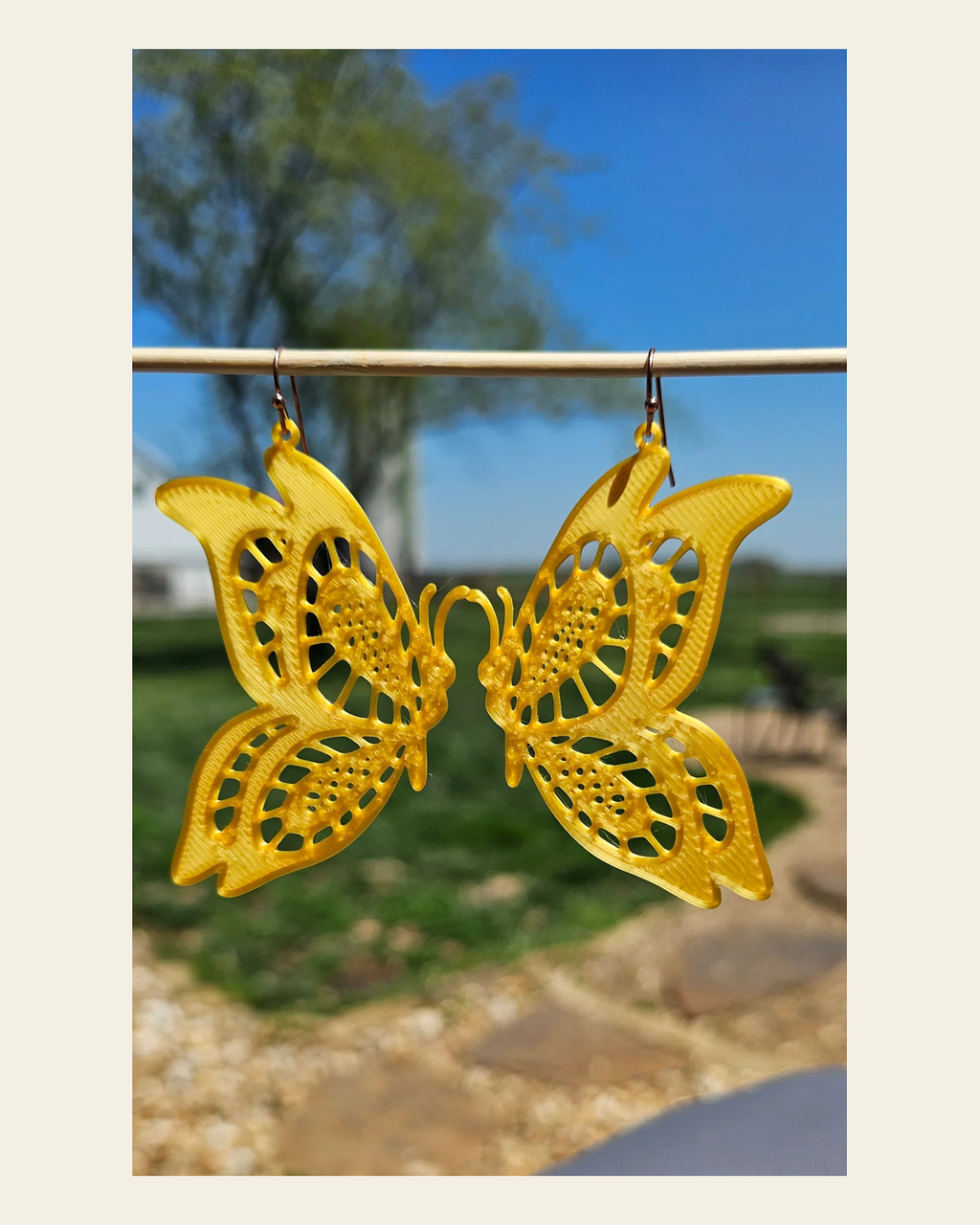 3D Print Butterfly Boho Earrings Made in America on a warm cream background