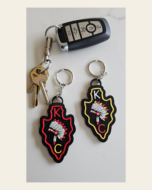 3D Print Chiefs Arrowhead Kc Kansas City Football Keychain Made in America on a warm cream background