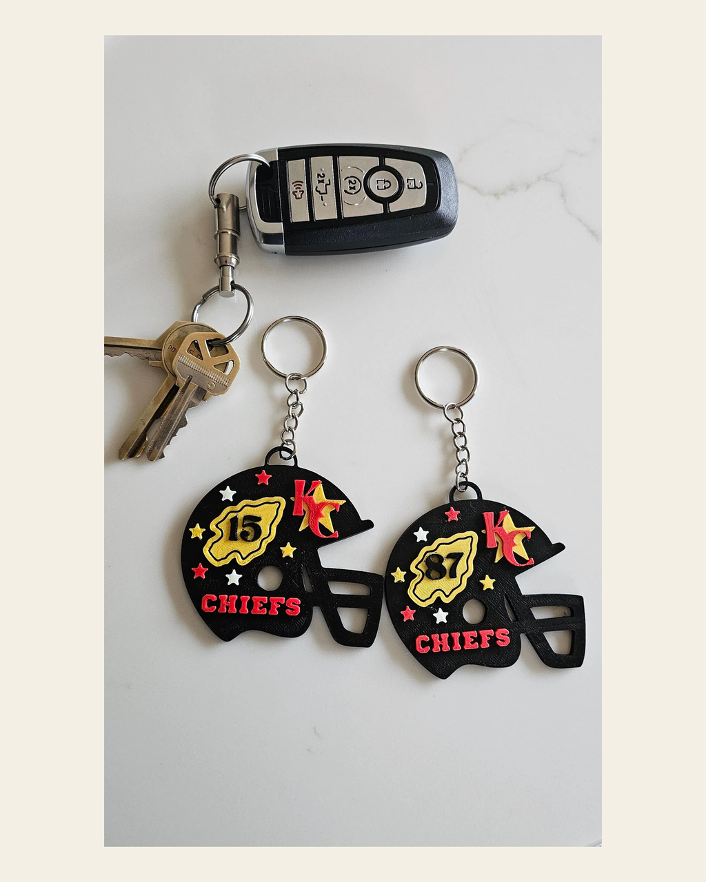 3D Print Chiefs Helmet Arrowhead Kc 15 Mahomes Kansas City 87 Kelce Football Keychain Made in America on a warm cream background