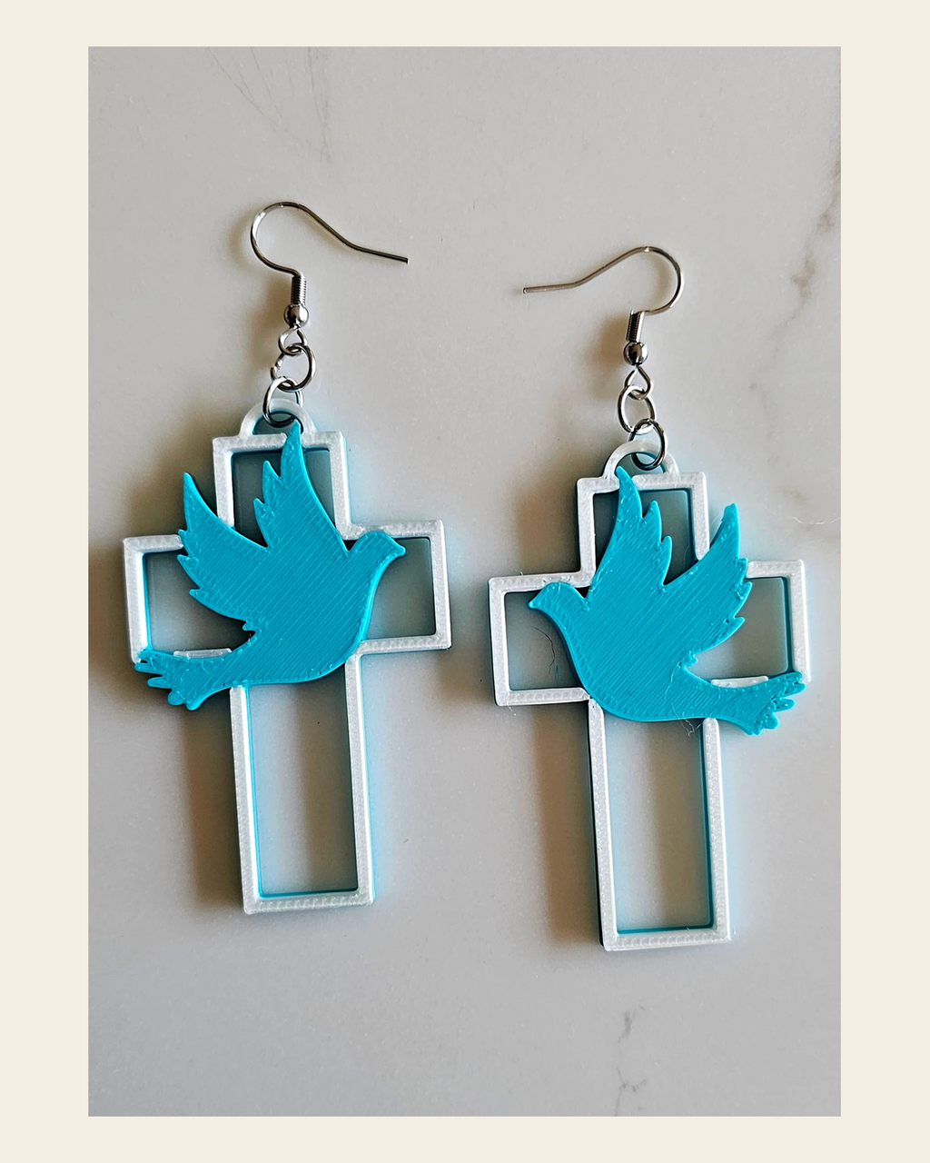 3D Print Christian Cross Faith Earrings Made in America on a warm cream background