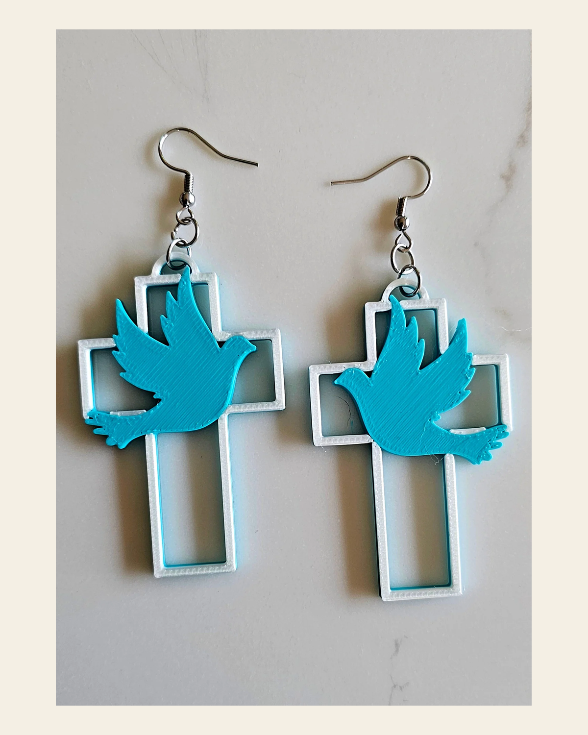 3D Print Christian Cross Faith Earrings Made in America on a warm cream background