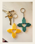 3D Print New Mexico Zia Heart Keychain Made in America on a warm cream background