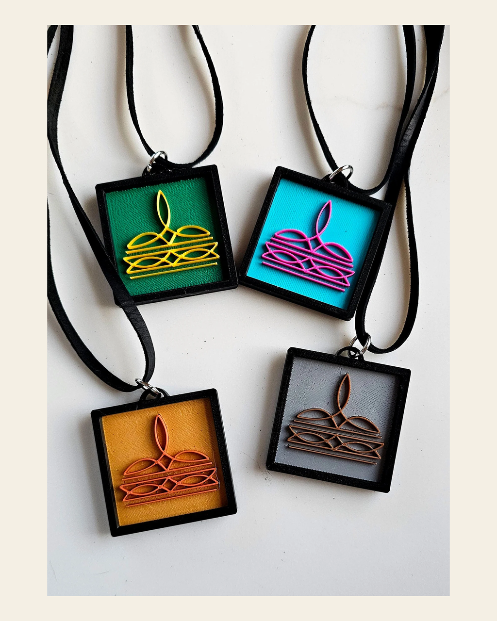 3D Print Picture Necklace on Deerskin Leather Western Bootstitch Made in America on a warm cream background