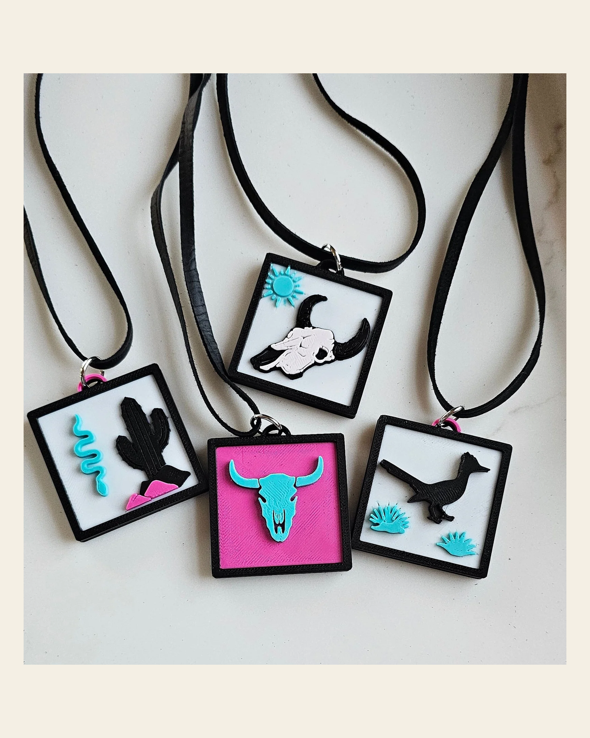 3D Print Picture Necklace on Deerskin Leather Western Bull Skull Desert Cactus Made in America on a warm cream background
