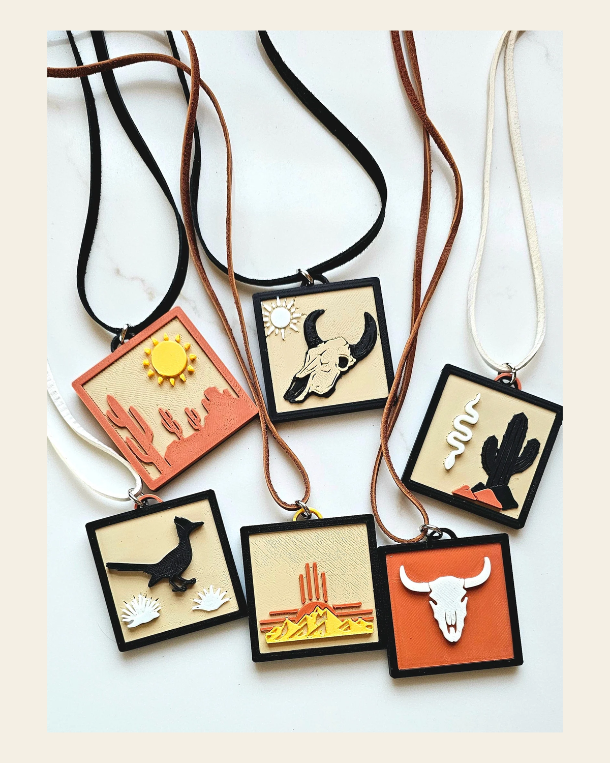 3D Print Picture Necklace on Deerskin Leather Western Bull Skull Desert Cactus Made in America on a warm cream background