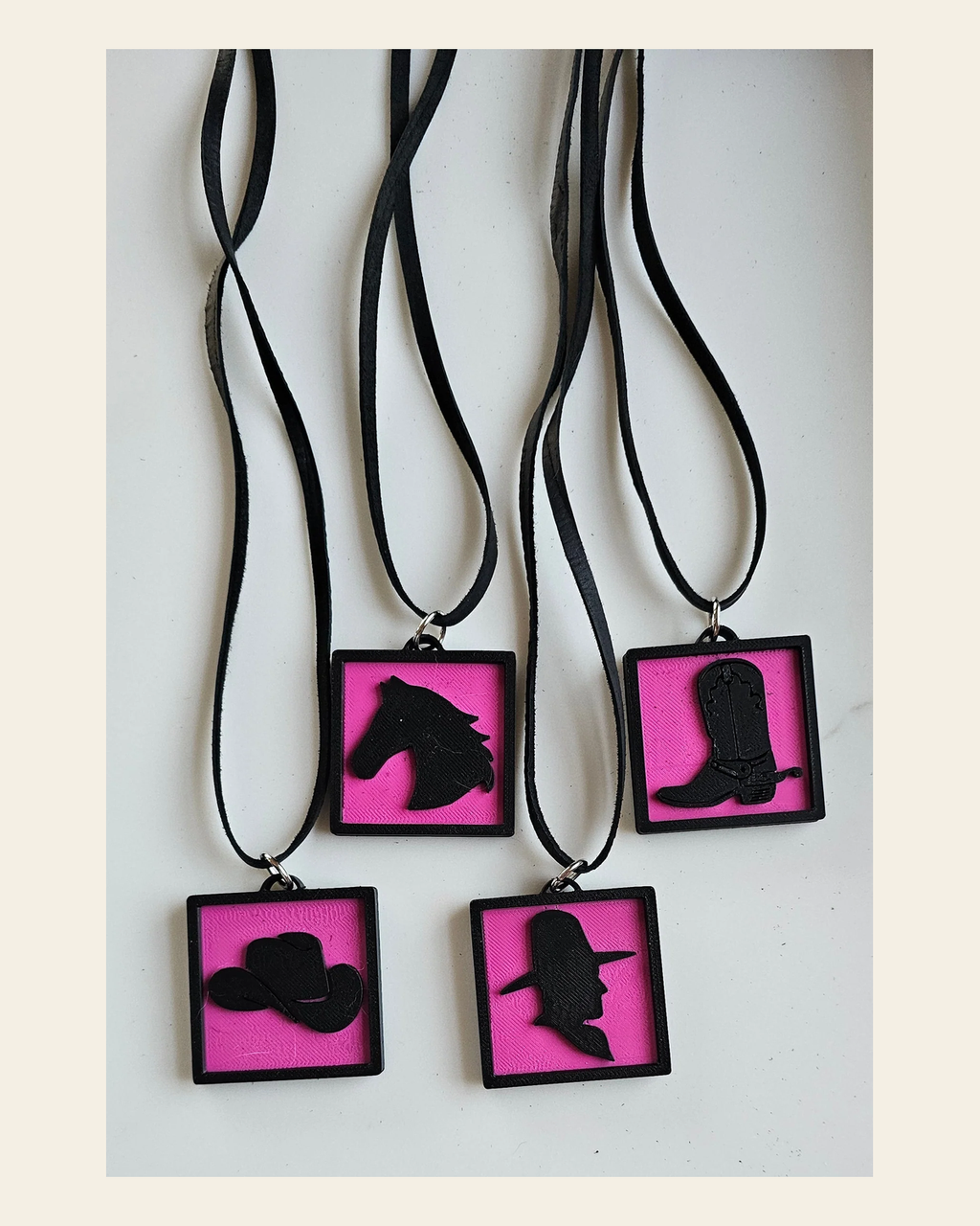 3D Print Picture Necklace on Deerskin Leather Western Cowboy Horse Hat Boot Made in America on a warm cream background