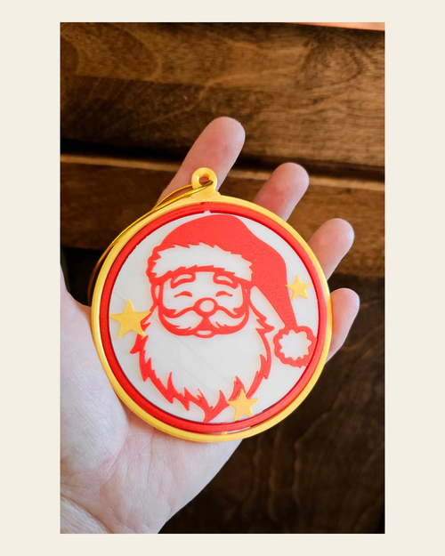 3d Print Santa Claus Christmas Ornament on a warm cream background