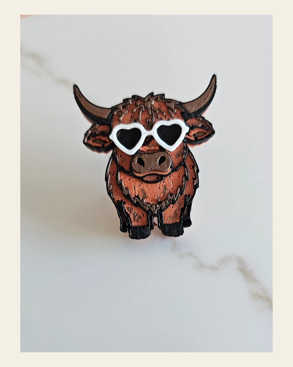3d Printed Cool Highland Brown Cow Magnet Made in America on a warm cream background