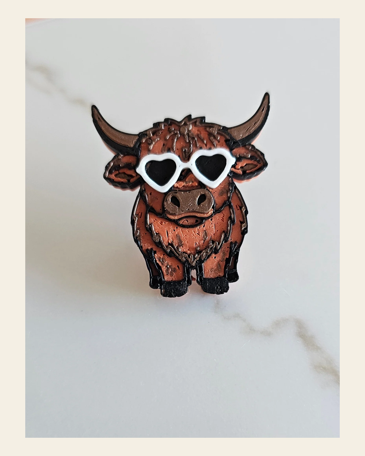 3d Printed Cool Highland Brown Cow Magnet Made in America on a warm cream background
