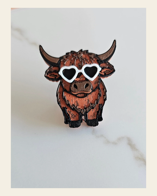 3d Printed Cool Highland Brown Cow Magnet Made in America on a warm cream background