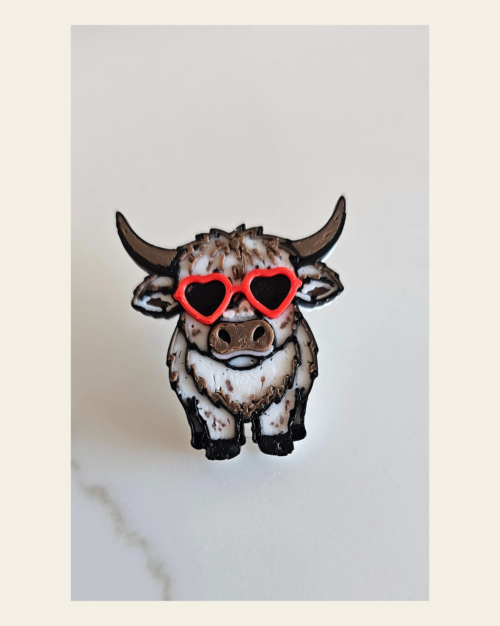 3d Printed Cool Highland Cow Hat Pin Made in America on a warm cream background