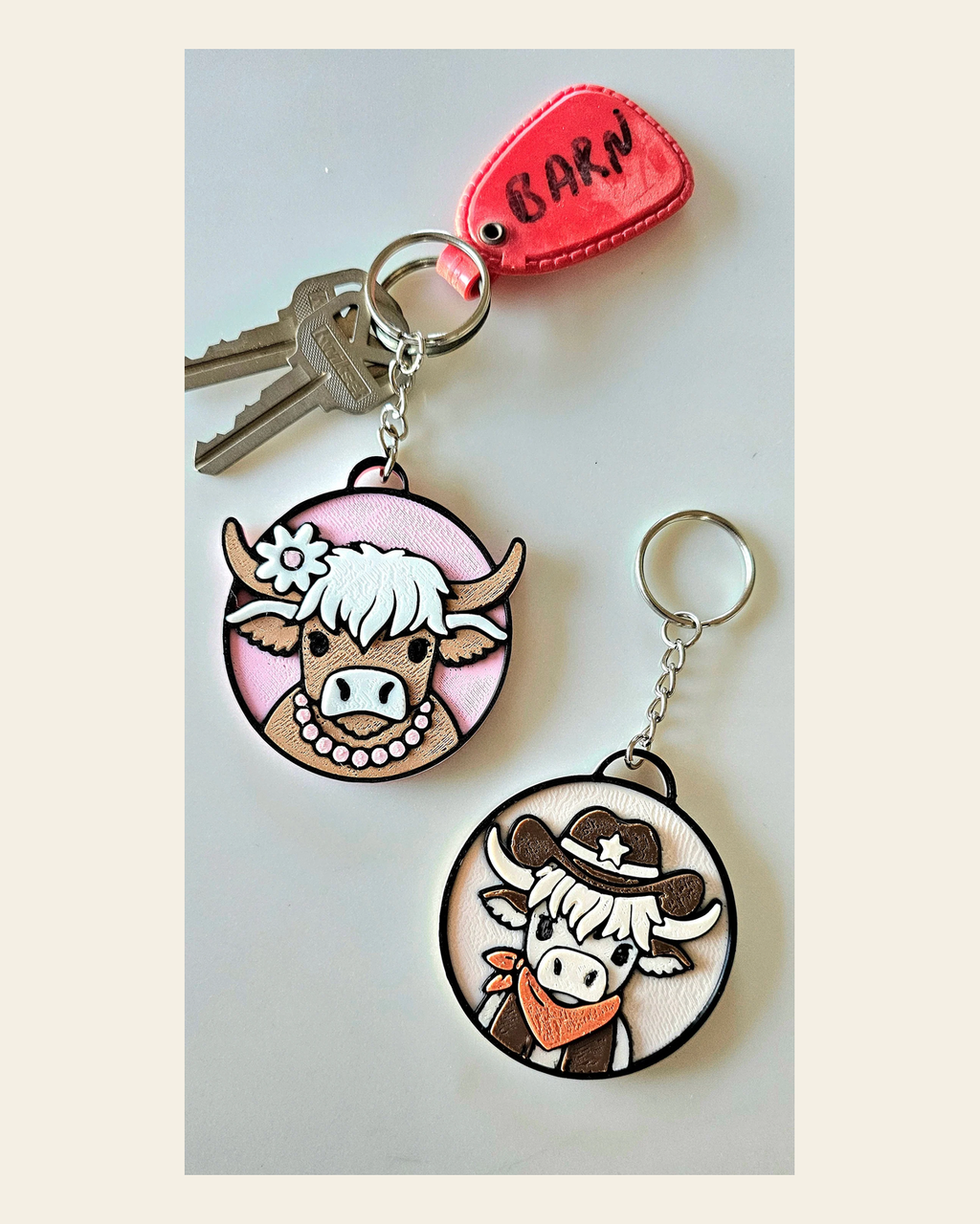 3d Printed Cowboy Cowgirl Highland Cow Cute Keychain on a warm cream background