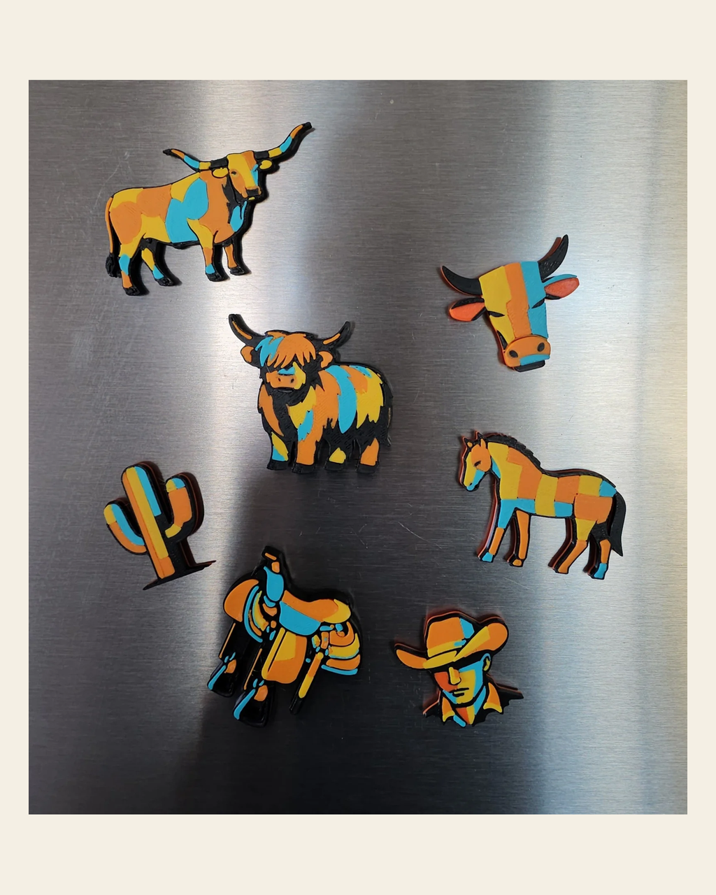 3d Printed Farm Western Longorn Horse Cow Magnet Made in America on a warm cream background