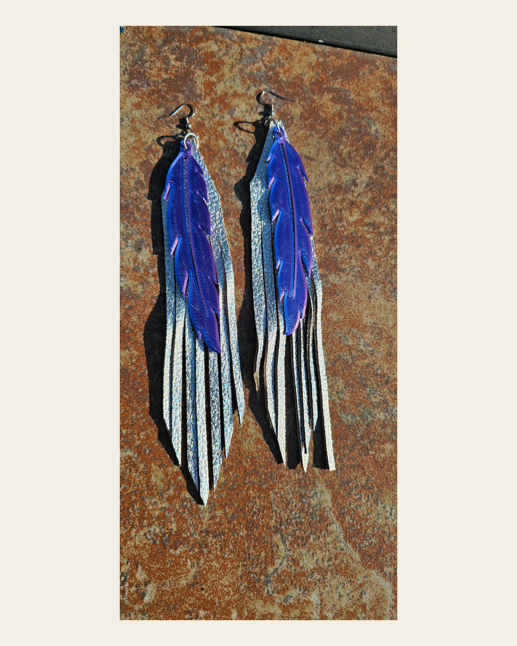 3D Printed Feather Leather Fringe Earrings Made in America on a warm cream background