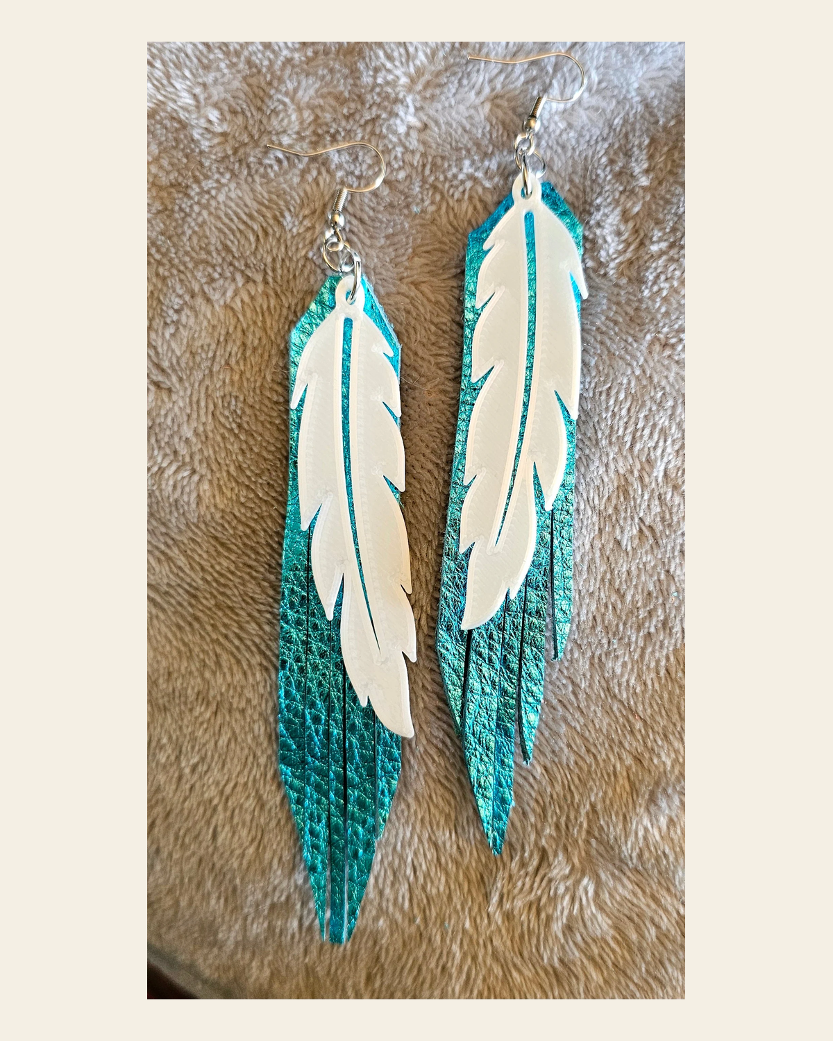 3D Printed Feather Leather Fringe Earrings Made in America on a warm cream background