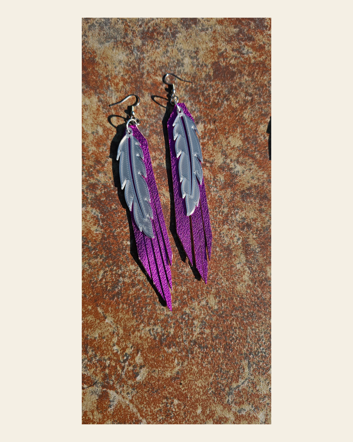 3D Printed Feather Leather Fringe Earrings Made in America on a warm cream background