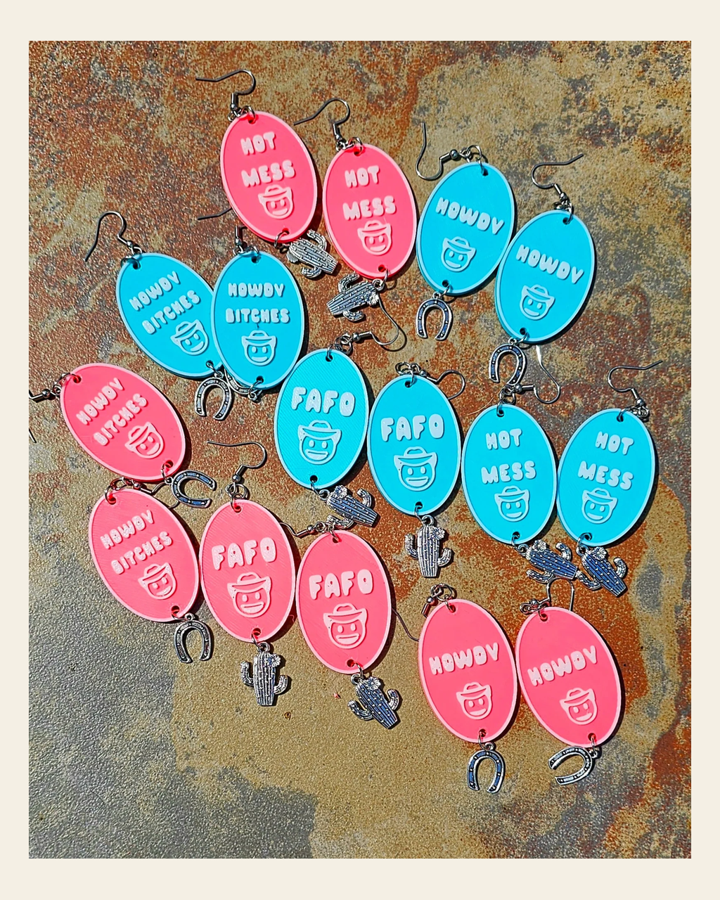 3D Printed Word Salad Earrings on a warm cream background