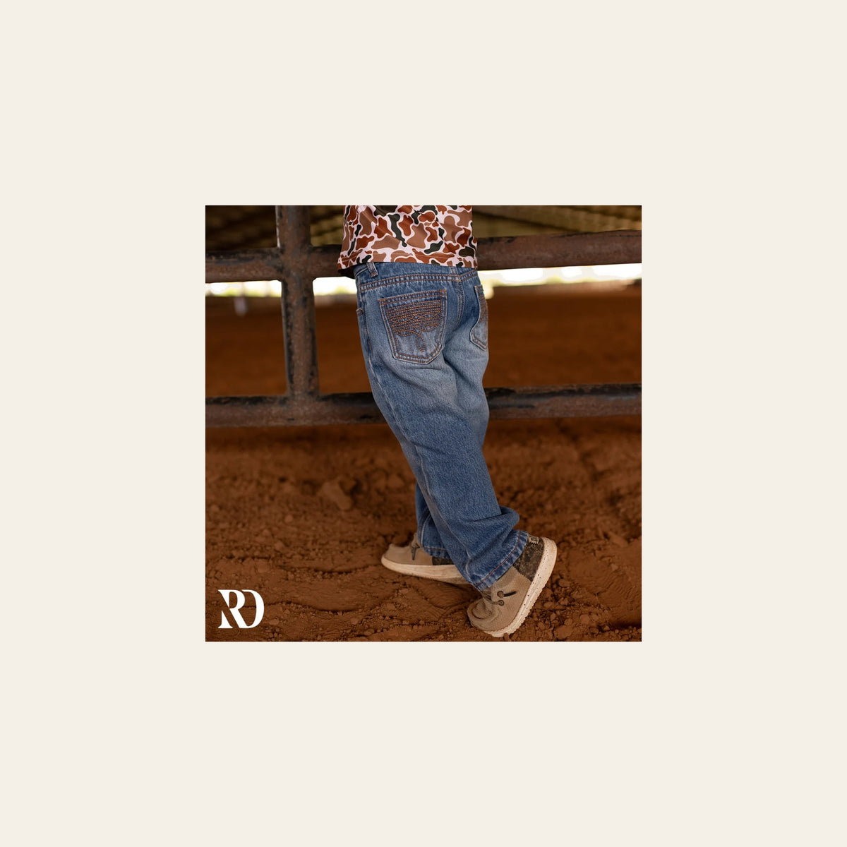 Bam Bootcut - Medium Wash Toddler Boy Denim on a warm cream background