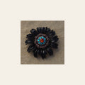 Black Daisy Flower With Copper Fire Opal and Teal 1" Concho on a warm cream background