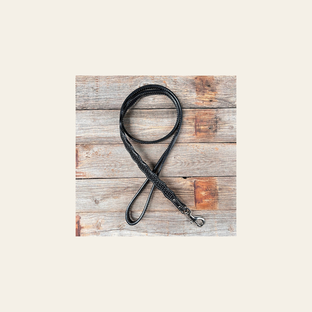 Black Genuine Leather leash 4' x 1" wide on a warm cream background