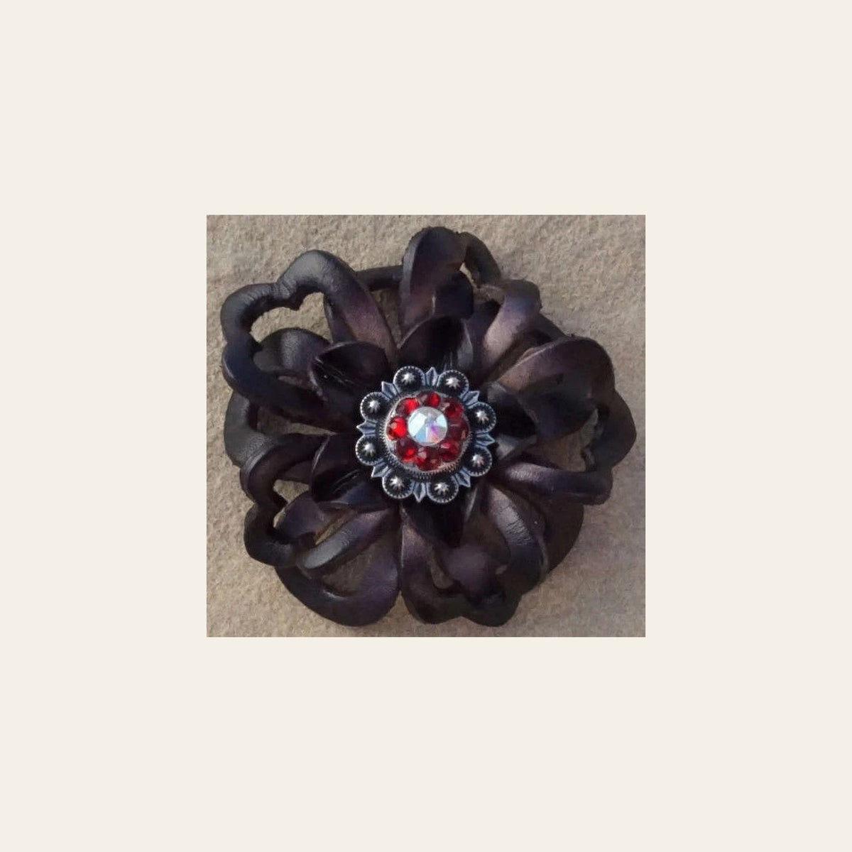Black Lotus Flower With Antique Silver Ruby and AB 1" Concho on a warm cream background