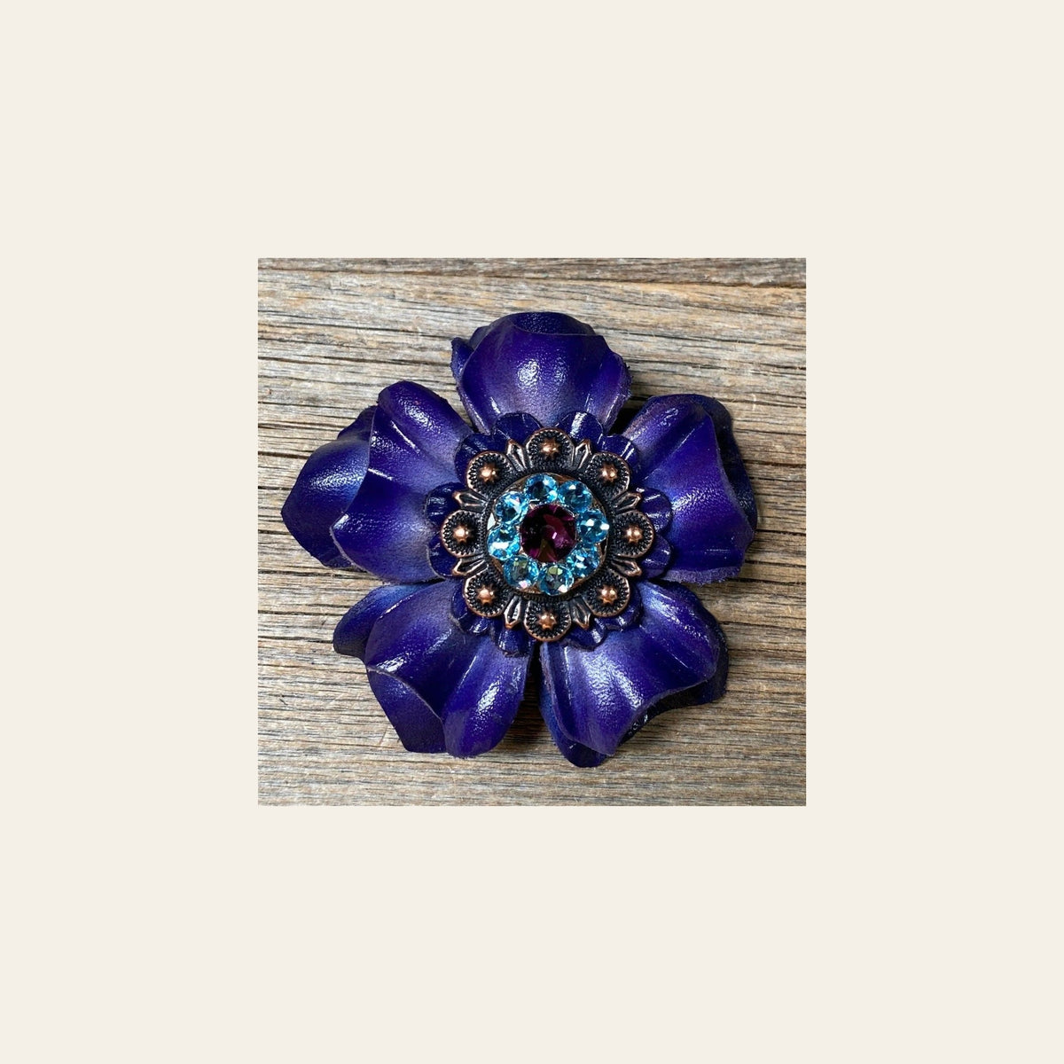 Blue Carnation Flower With Copper Amethyst & Aqua 1" Concho on a warm cream background