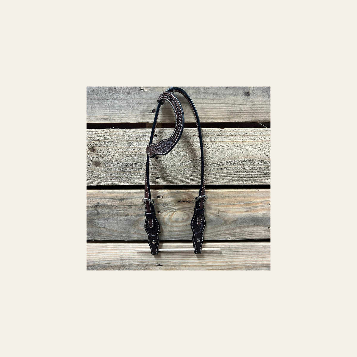 Dark Oil Cob - Gag One Ear Headstall / Bridle- Short Cheeks on a warm cream background
