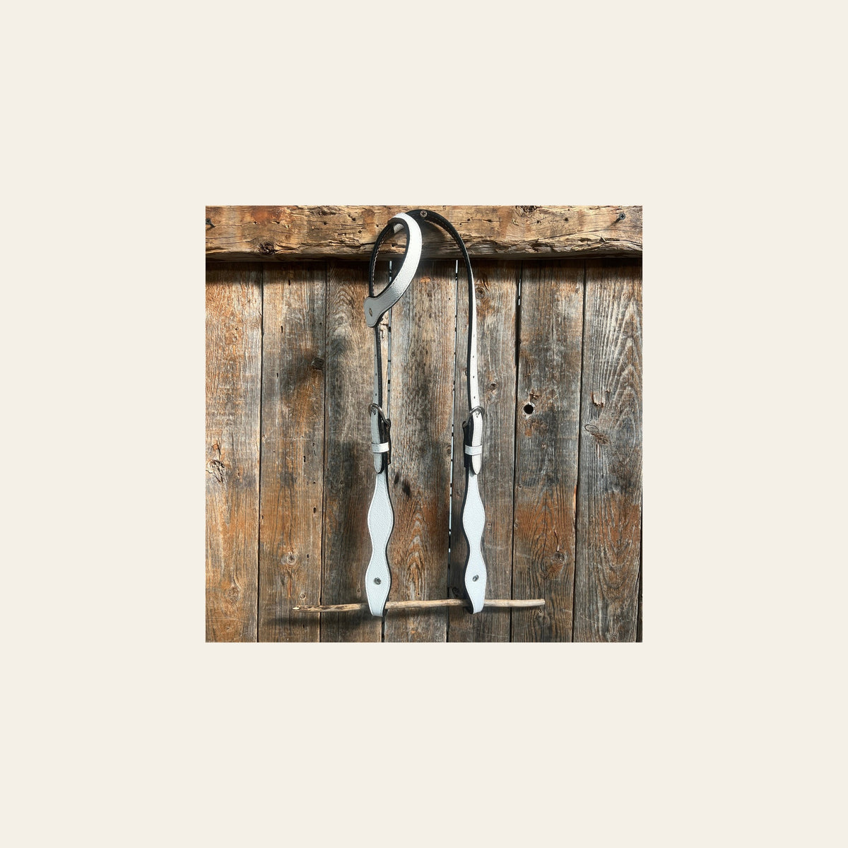 White Genuine Leather One Ear Headstall / Bridle on a warm cream background
