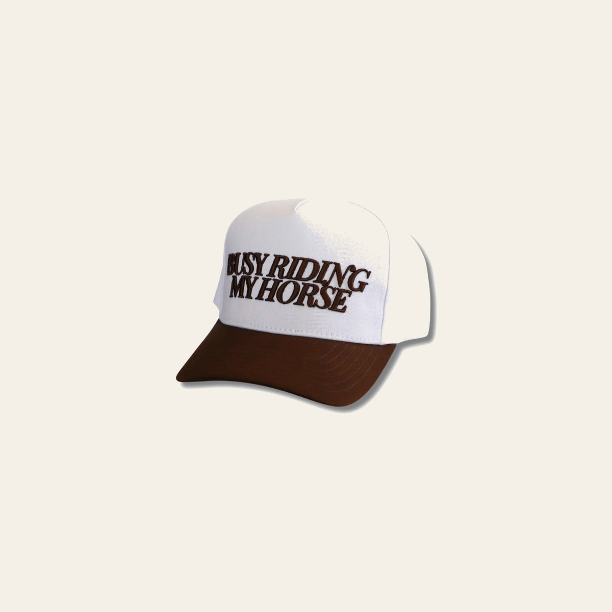 Busy Riding My Horse (chocolate) Hat on a warm cream background