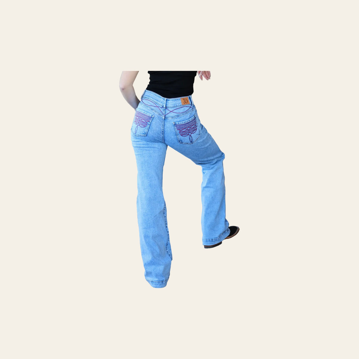 Cheyenne Trousers - Acid Wash Red Pocket on a warm cream background