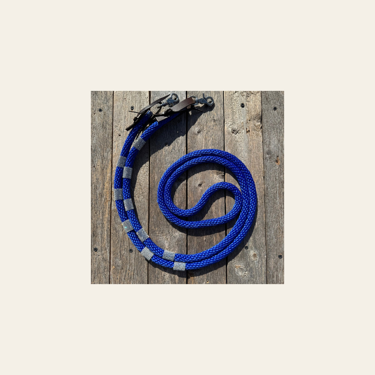 Cobalt Nylon Barrel Racing Reins with Rhinestones #BNR105 on a warm cream background