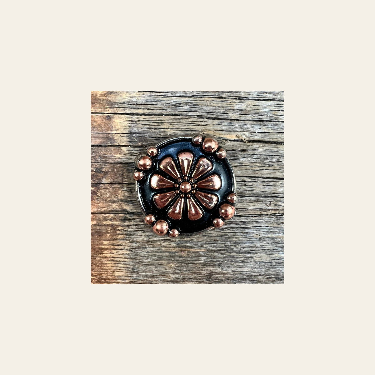 Copper Flower 1.25" Concho W196L on a warm cream background