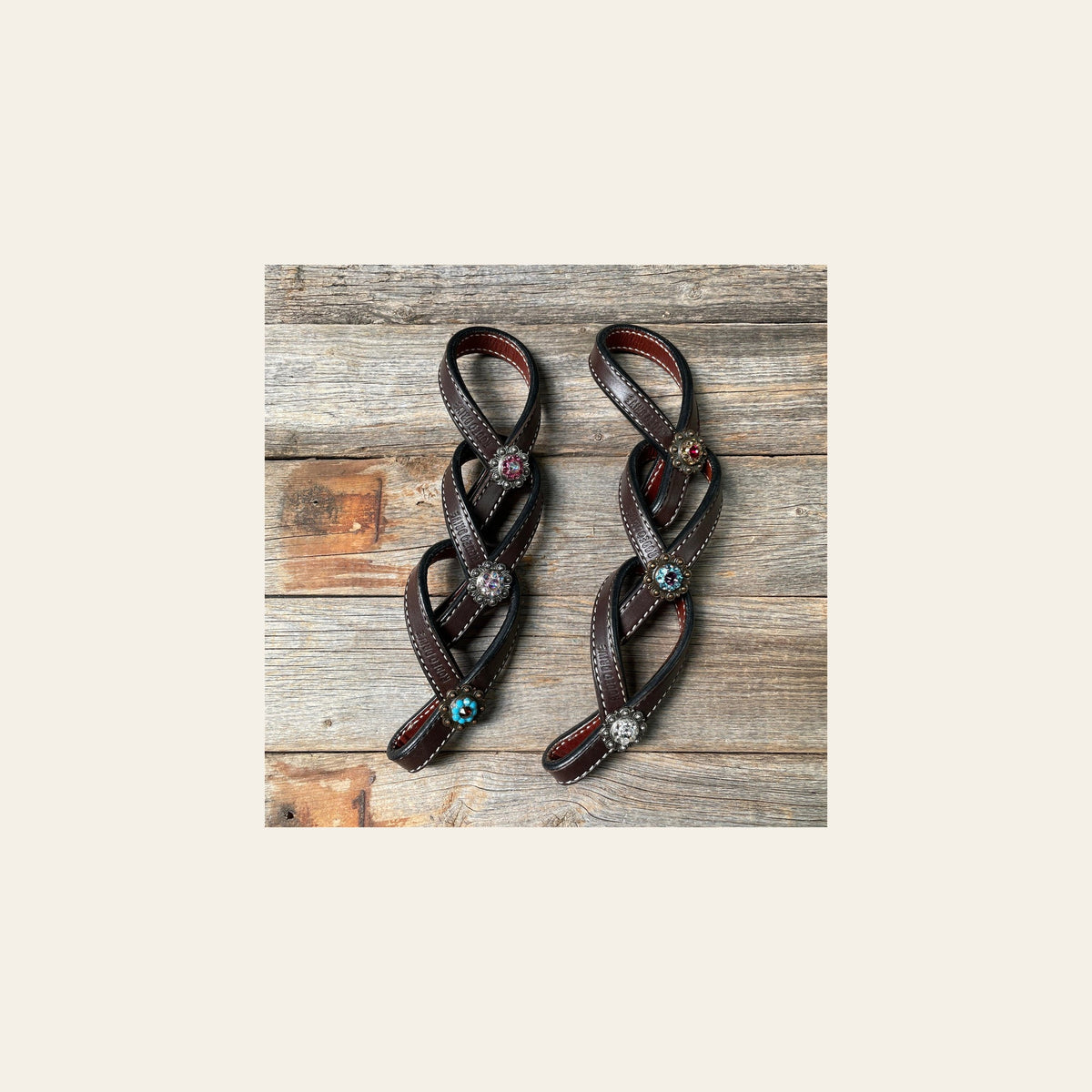 Crystal Dark Oil Rustic Tie Down Keepers on a warm cream background