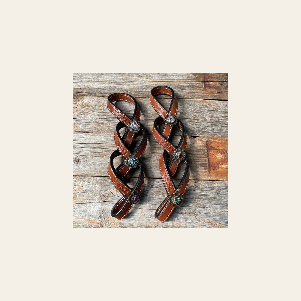 Crystal Medium Oil Rustic Tie Down Keepers on a warm cream background