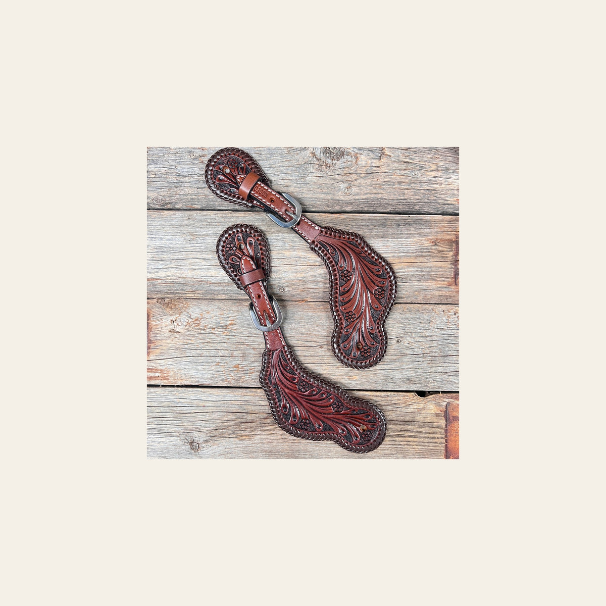 Dark Oil Braided Spur Straps #87052 on a warm cream background