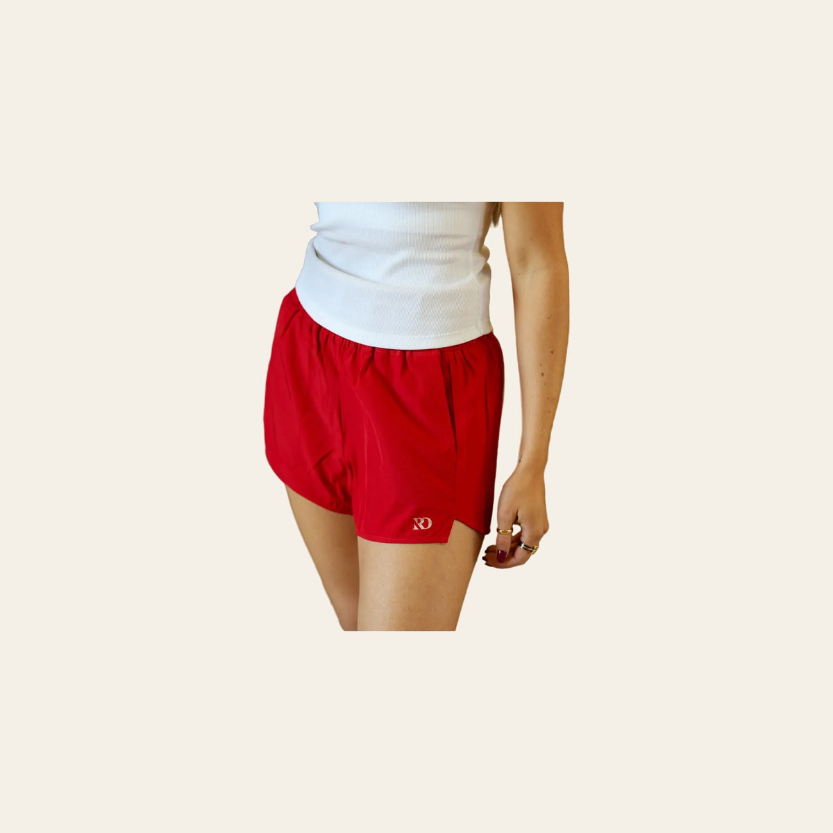 Essentials Shorts | Red on a warm cream background