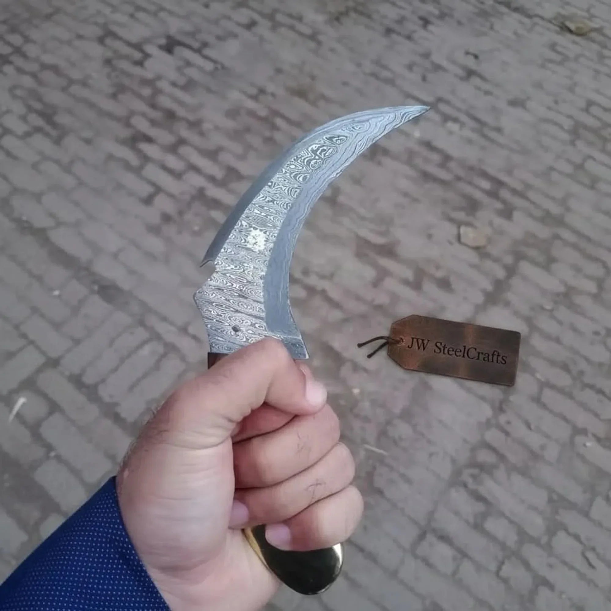 Damascus karambit knife..