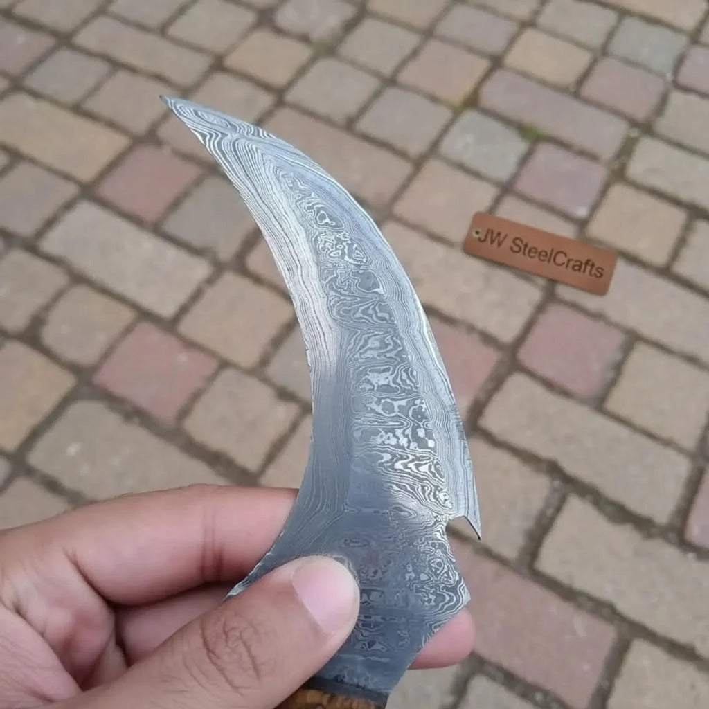 Damascus karambit knife..