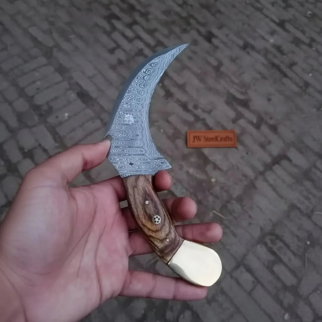 Damascus karambit knife..