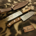 Raindrop Damascus Hunting Knife Set – Trailing Point Skinner & Drop Point Hunter with Rosewood Handles | Full Tang Fixed Blade Pair