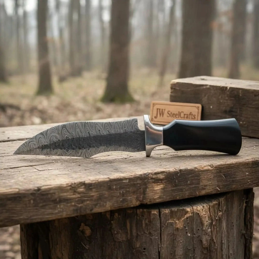 Damascus Trailing Point Fixed Blade Hunting Knife — Forged Ladder Pattern Blade, Black Resin Handle & Steel Guard