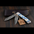 Dual-Blade Folding Trapper Sky Blue Resin Handle Steel Bolster Trapper