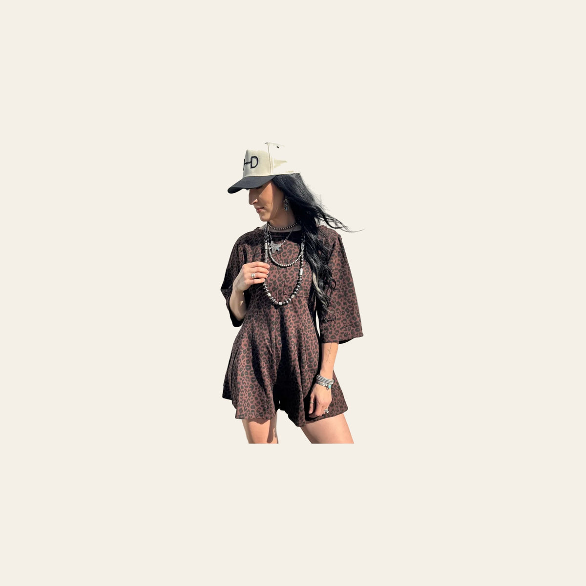 Lena Leopard | Romper on a warm cream background