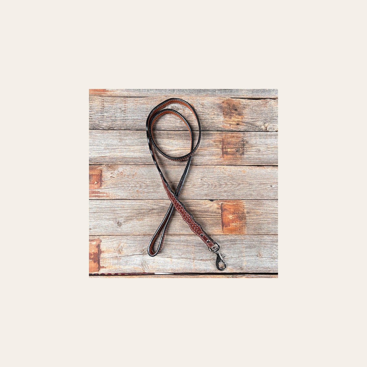 Medium Oil Genuine Leather leash 4' x 1" wide on a warm cream background