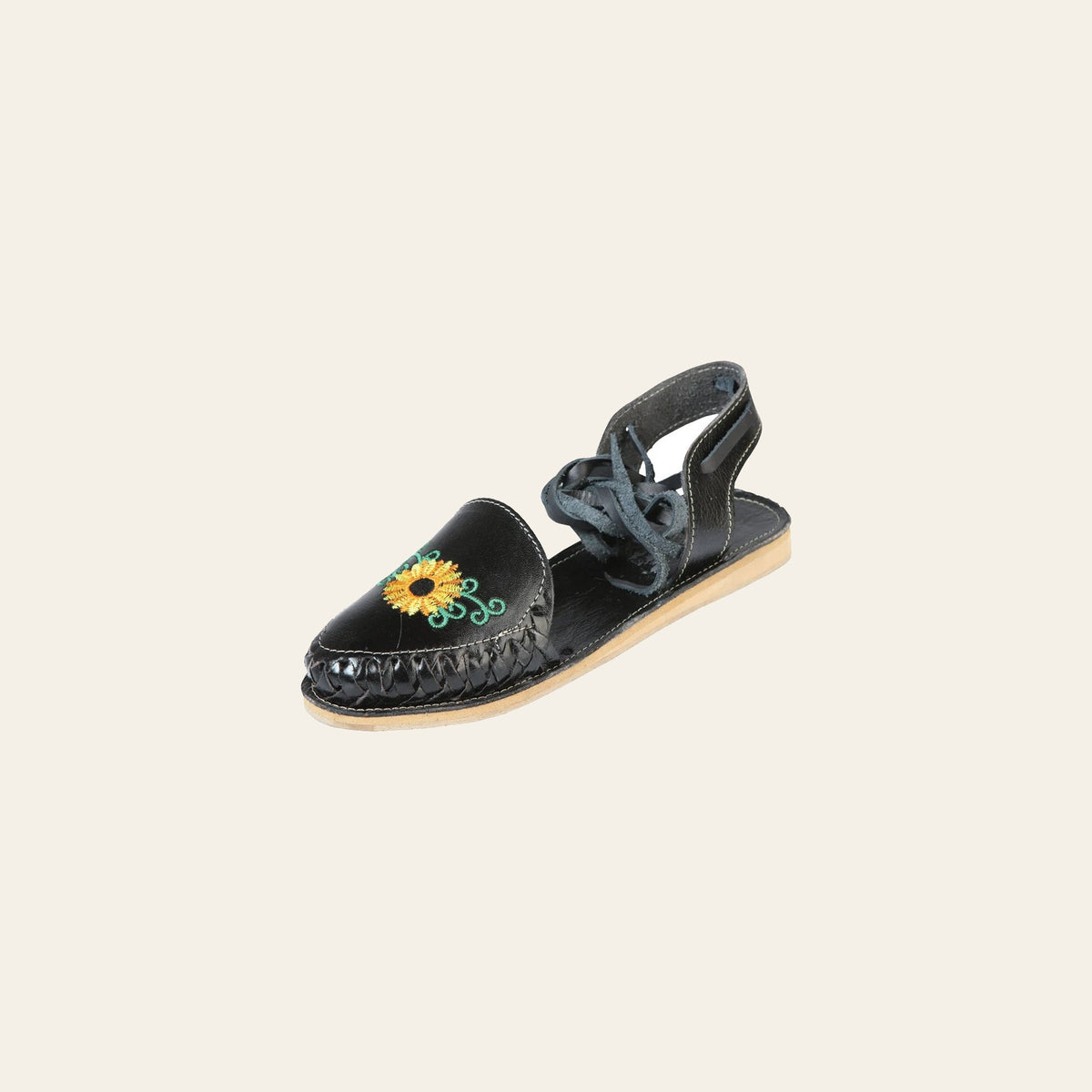 Mexican Artisanal Sandals Leather Black 603919 on a warm cream background