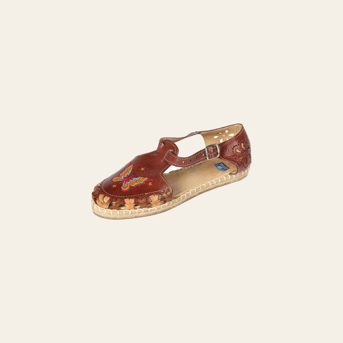 Mexican Artisanal Sandals Leather Brown 603317 on a warm cream background