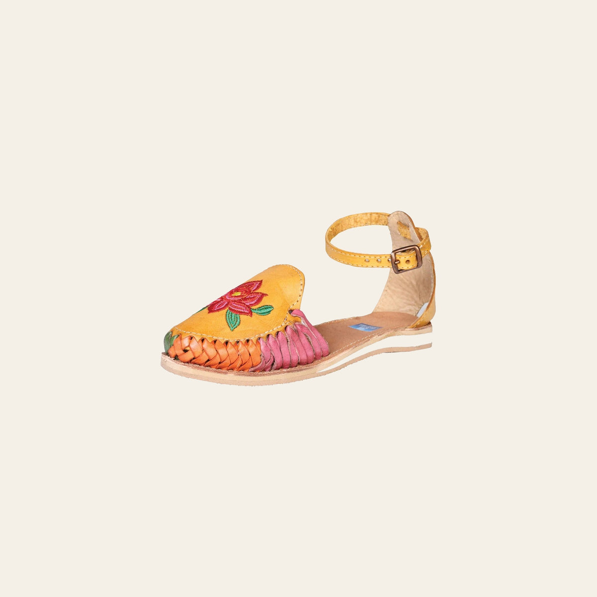 Mexican Artisanal Sandals Leather Mustard 602363 on a warm cream background